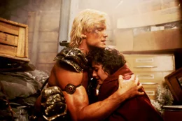 L-R: He-Man (Dolph Lundgren), Julie Winston  (Courteney Cox)