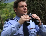 Sgt. Bellanger (played by Sidy Correa) surveys the area.