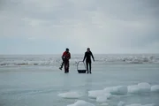 Zeke and Glen on ice prepare to drill. Zeke and Glen on ice prepare to drill.