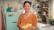 Portrait of Molly Yeh making her Squash & Apple Salad with Grainy Mustard Dressing, as seen on Girl Meets Farm, season 6.