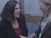 Candice Fiore at work talking to coworker.