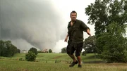 Reed flees an oncoming tornado outside of Philadelphia, Mississippi