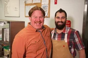 Host Casey Webb smiles with BeetleCat Executive Chef Andrew Isabella, as seen on Man v. Food.