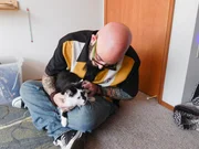 Jackson Galaxy holds Lux the cat.