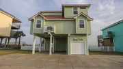 The exterior of the Bay Shore House in Galveston, Texas, as seen on HGTV's Beach Hunters.