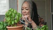 Ayanna with her herb garden