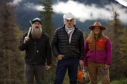 L-R: Matt Raney, Marty Raney, and Misty Bilodeau posing for a hero shot in front of a mountain and forest landscape.