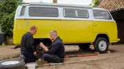 Ant Anstead and Darren sitting on the floor infront of the camper