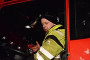 Odda, Norway - Olav Eike (one of Thord´s employees) drives the towing truck. He is ready to rescue with Thord and Tor Steinar. Odda, Norway - Olav Eike (one of Thord´s employees) drives the towing truck. He is ready to rescue with Thord and Tor Steinar.
