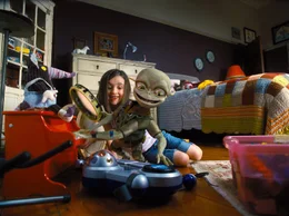 Friendly alien Sparks and Hannah (Ashley Boettcher) delight in their inter-galactic friendship. . Aliens in the Attic