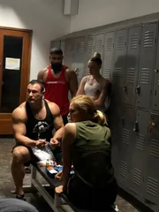 Mariana in gym locker room with Tony as he prepares PED injections for himself and friends.