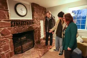 As seen on HGTV's Mountain Life, homebuyers Denise and Justin love the stone fireplace in the Green Field House in Corbett, Oregon.