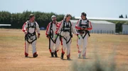 The team walking together in skydive gear. The team walking together in skydive gear.