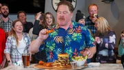 Host Casey Webb taking on the Menu Burger Challenge at Fox and Hound in Lake Tahoe as seen on Man v. Food, season 6.