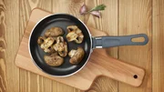 Fried mushrooms in a frying pan. Fried mushrooms in a frying pan.