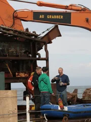 The AU Grabber crew talking outfront.