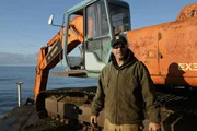 Hank standing near the dredge.