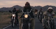 Jason rides with his friends in the desert