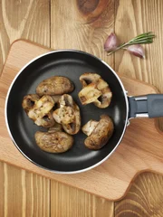 Fried mushrooms in a frying pan.