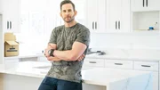 As seen on HGTV&rsquo;s Flipping 101, host Tarek El Moussa poses for a photo in the kitchen of a flip he is coaching on.