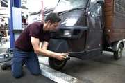 Nissan Skyline R33 GTS-T Dream Car episode. Marc 'Elvis' Priestley works on the Piaggio Ape at the workshop.