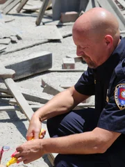 Fire department gridding the crime scene.