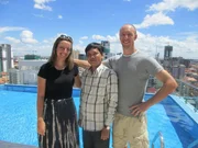 Portrait shot of contributors Philip Butterworth and Hillary Vance with agent Sophia Srun in Phnom Penh, Cambodia.