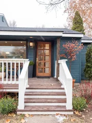 The front steps and entrance of the Spring home after renovation.
