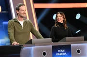 Die Kandidat:innen des Teams "Kamera": Der Schauspieler J&ouml;rg Hartmann (l.) und die Schauspielerin Aylin Tezel (r.).