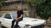 Ant Anstead sitting on the bonnet of the Thunderbird at the farm