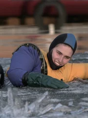 Gary Vaillancourt teaches daughter Molly MacKinnon ice-melting survival techniques.