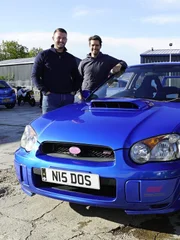 Mike, Elvis and contributor posing with dream car.