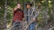 Chad Ollinger points out something unusual to Josh Feldman as they chart a new path across the ranch.