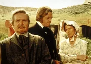 Dr. Baker (Kevin Hagen, M.) bittet Caroline Ingalls (Karen Grassel, r.), den Schulunterricht zu &uuml;bernehmen.