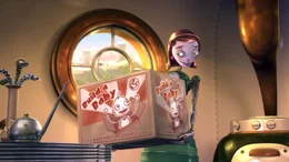 Mrs Copperbottom erh&auml;lt ihren Robotersohn Rodney in Form eines nagelneuen Bausatzes.