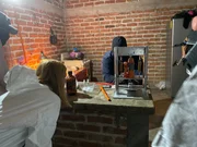 Mariana van Zeller (L) observes as a cartel chemist presses fentanyl into pills. (Credit: National Geographic)