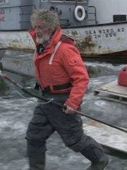 Brian Abbott heads out to check the thickness of the ice cover.