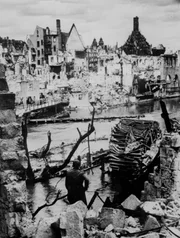 Pegnitz River, Nuremberg, Germany - Choked with debris, a bombed water intake of the Pegnitz River no longer supplies war factories in Nuremberg, vital Reich industrial city and festival center of the Nazi party, which was captured April 20, 1945, by troops of the U.S. Army.