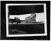 England - US Paratroopers lining up before taking off on training maneuvers somewhere in England.