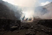 The center point of Mount Nyiragongo volcano smoking during the day. (photo credit: National Geographic)