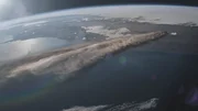 CGI of Earth's atmosphere with volcanic plumes streaming.