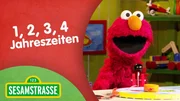 Elmo hat zu Julias &Uuml;berraschung eine Uhr gebaut, mit der er die Jahreszeiten einstellen kann.