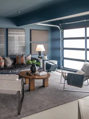 Josh Groban with the help of Drew and Jonathan Scott, renovated the garage and outdoor entertainment area for Josh's bandmate and friend, including music production equipment and jacuzzi tub, as seen on Celebrity IOU.