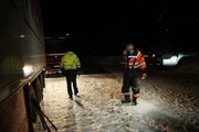 Eidfjord, Norway - Bjoern Laegreid (main cast in Eidfjord) talks in the phone with a customer. He has a little phone break before he can continue to help the truck.   (National Geographic)