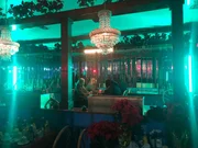 Mariana van Zeller interviewing pimp in restaurant.