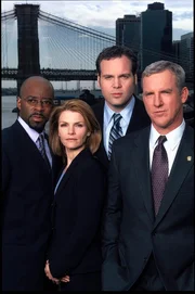 L-R: Ron Carver  (Courtney B. Vance), Detective Alexandra Eames (Kathryn Erbe), Detective Robert Goren (Vincent D'Onofrio), Captain James Deakins (Jamey Sheridan)
