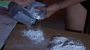 Preparing the cocaine for cutting.