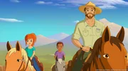Zo&eacute; (l.) und Harvey (M.) verbringen gemeinsam mit Graham (r.) einen Tag unter Cowboys und helfen Wildpferde einzufangen.