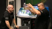 Wadye King and Brett Raymer work on the Gabriel Iglesias' Studio tank.