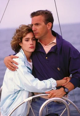 L-R: Susan Atwell (Sean Young) und Tom Farrell (Kevin Costner)